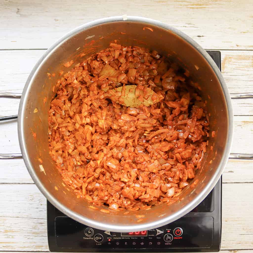 cooking onions together with paprika and spices