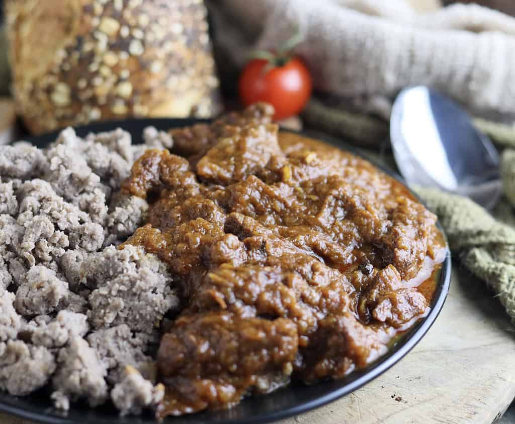 image showing cooked gulasz wolowy served with fresh bread and buckwheat dumplings