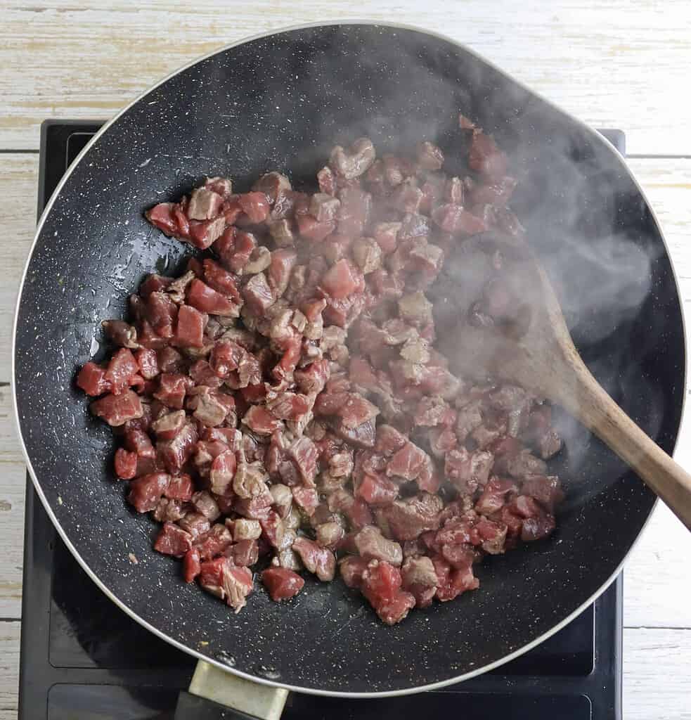 stir-frying the beef for tantuni
