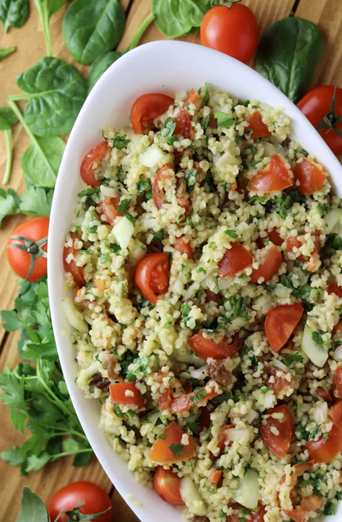 taboule oriental on the table with fresh cherry tomatoes