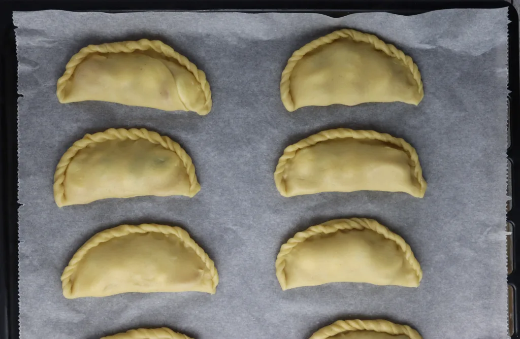 step - how to place the empanadas on a baking sheet