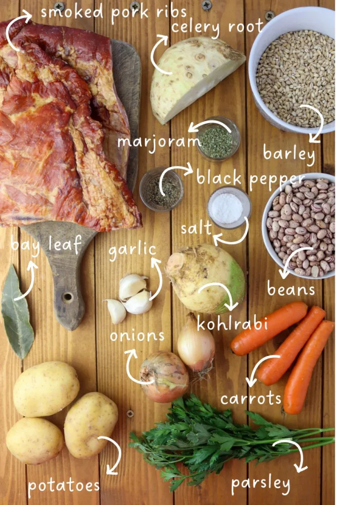 image of ingredients for ricet recipe - barley, beans, smoked pork ribs, kohlrabi, celery root, potatoes, parsley, carrots, onions, garlic, marjoram, salt and black pepper
