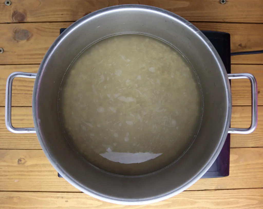 step two: place the soaked barley in a large cooking pot and cover it with water