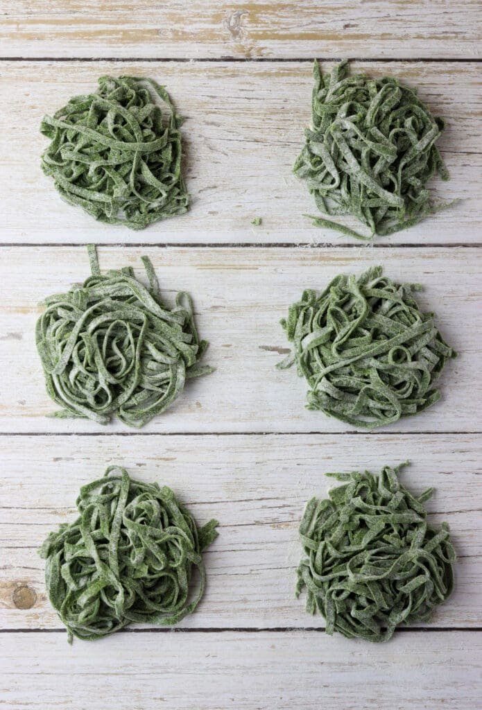how to lay the green wild garlic pasta noodles into small nests on flour-sprinkled surface before cooking or drying