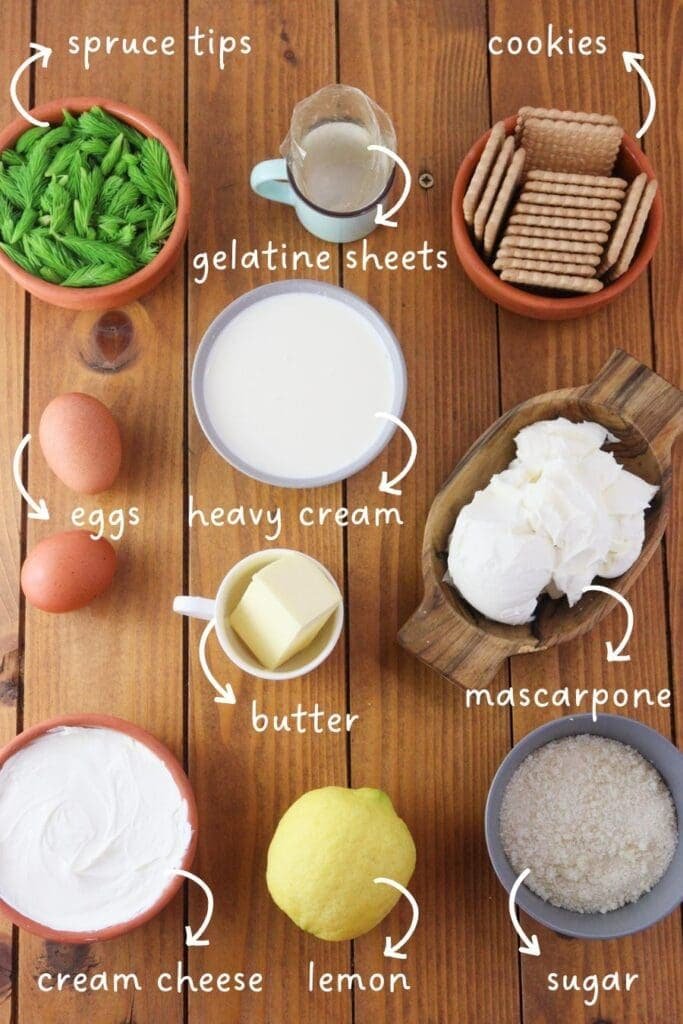 Gathering ingredients for spruce tip cakes; fresh spruce tips, heavy cream, mascarpone cheese, cream cheese, butter cookies, lemon, eggs, gelatine sheets and sugar. 