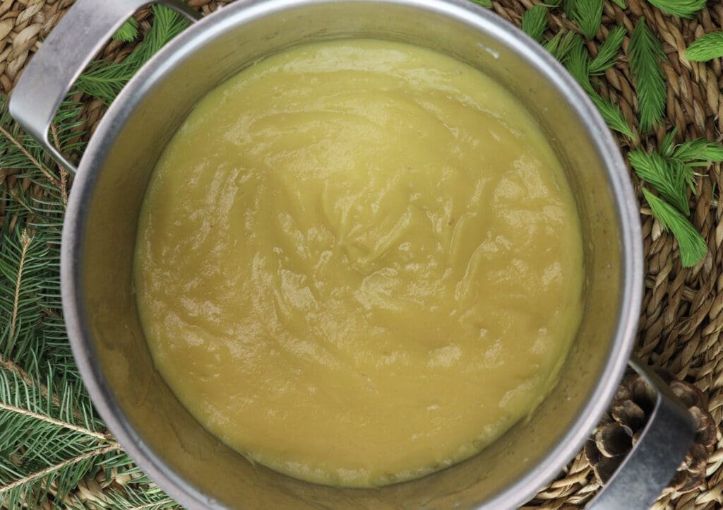 Image of a quick lemon curd cooked in a small pot. 