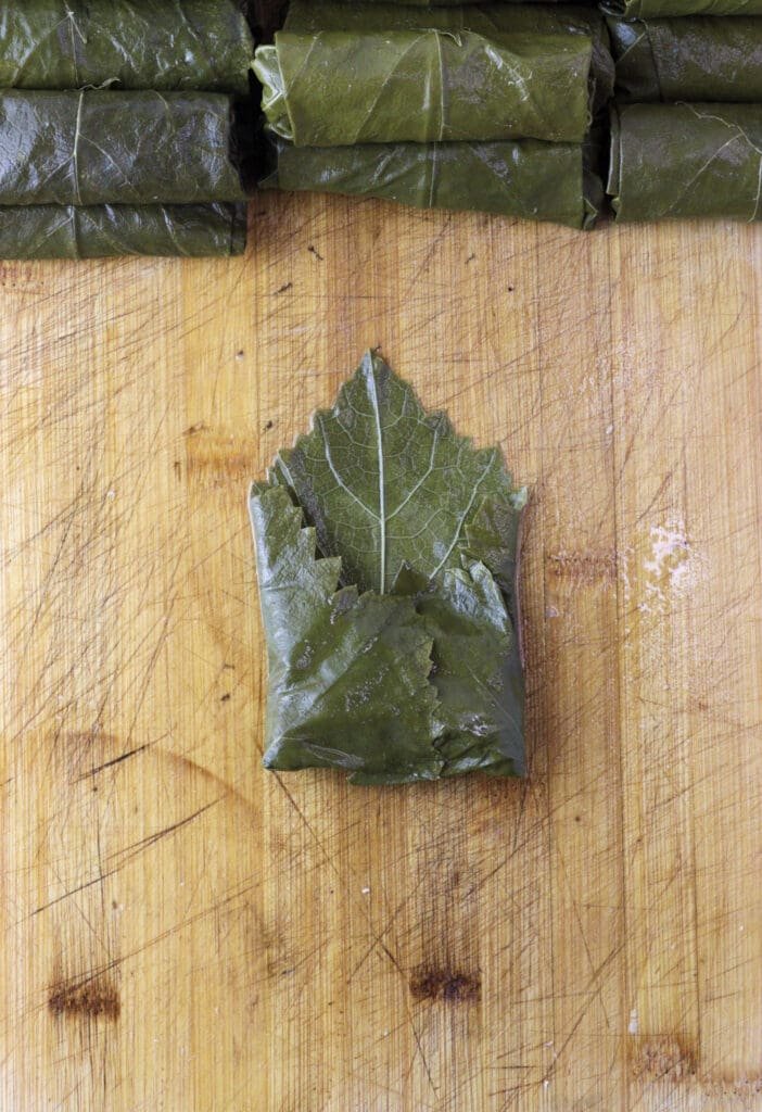 Third image of stuffing grape vine leaves