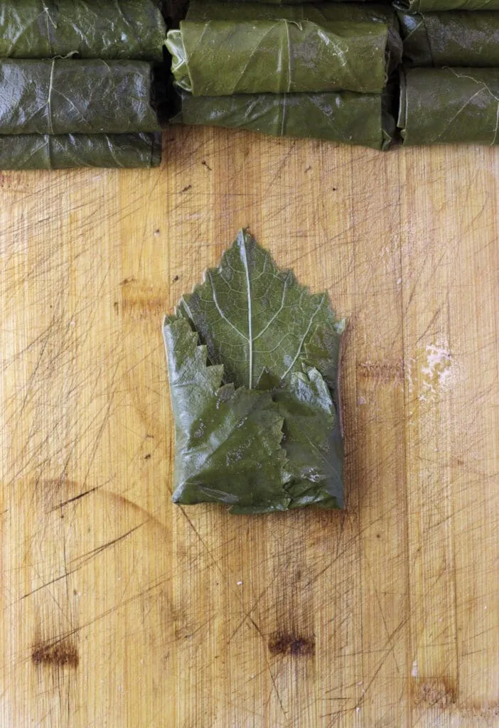Third image of stuffing grape vine leaves