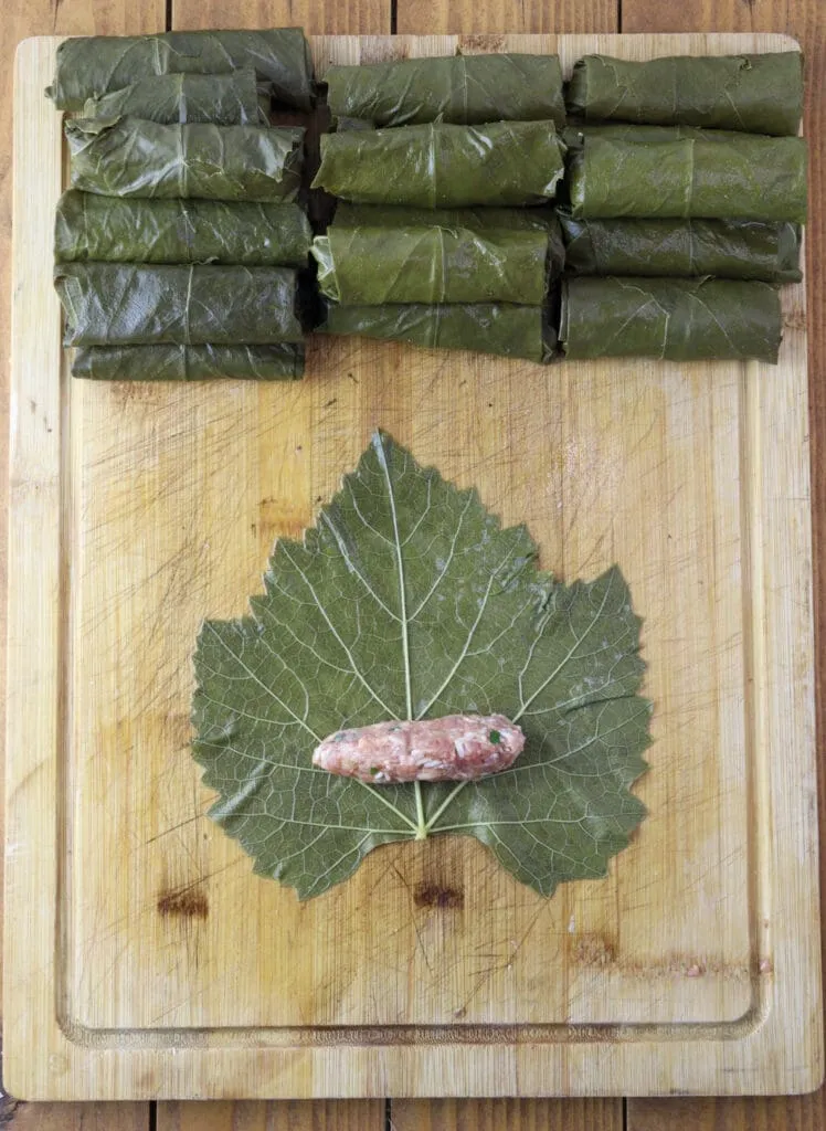 First image of how to stuff grape vine leaves. 
