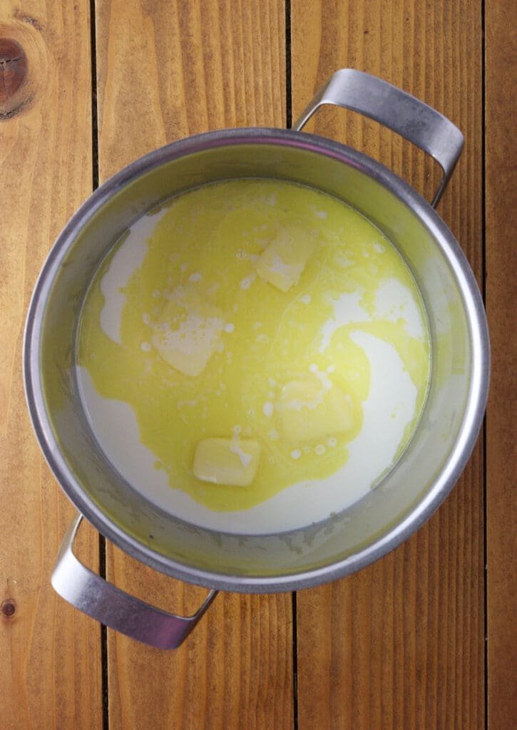Heavy cream and butter warming up in a pot