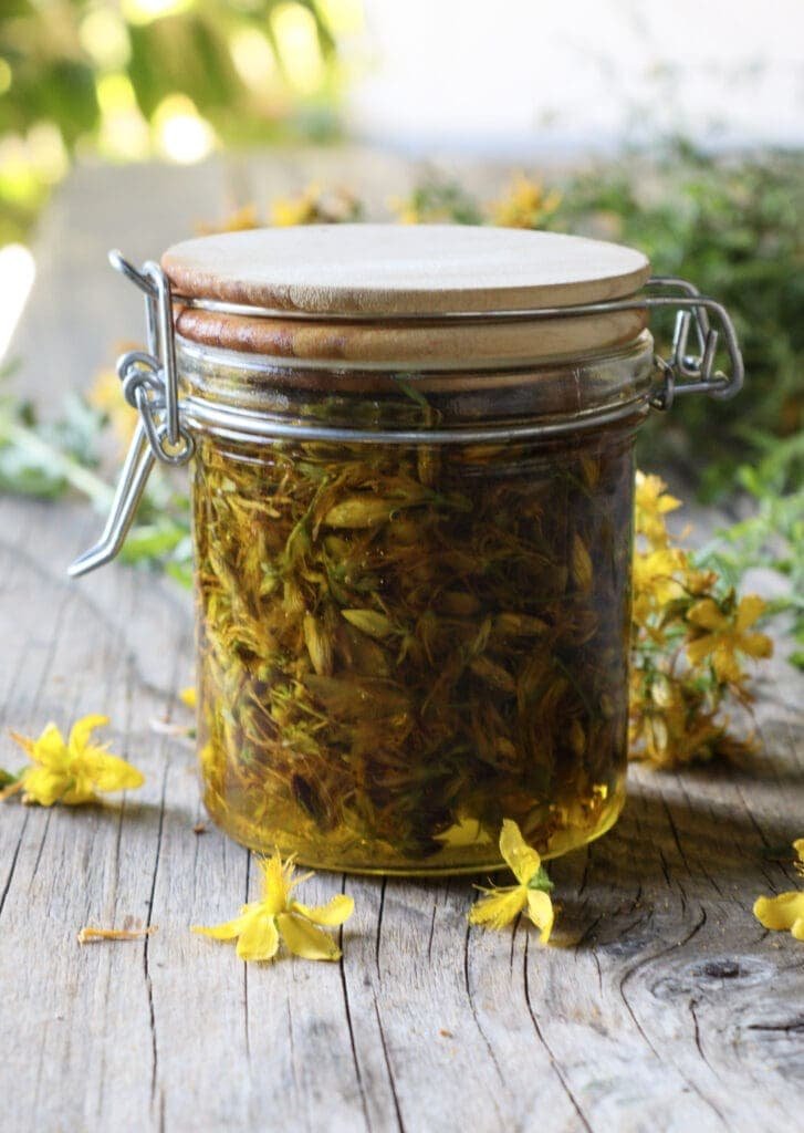 A jar of St. John's Wort flowers in olive oil 