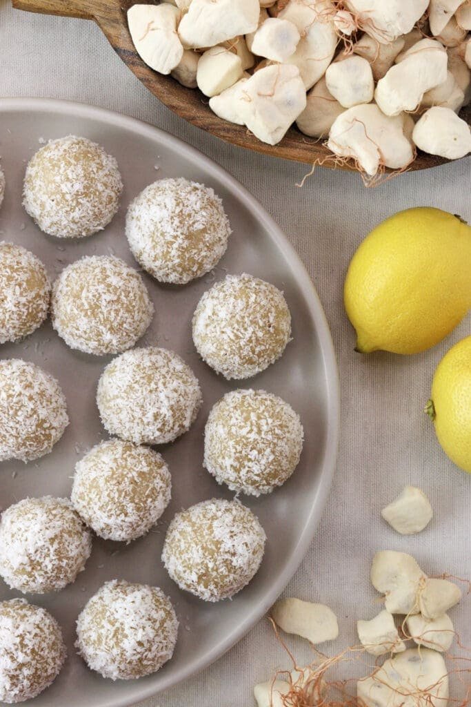 Coconut baobab bars rolled in deciccated coconut and served on the table