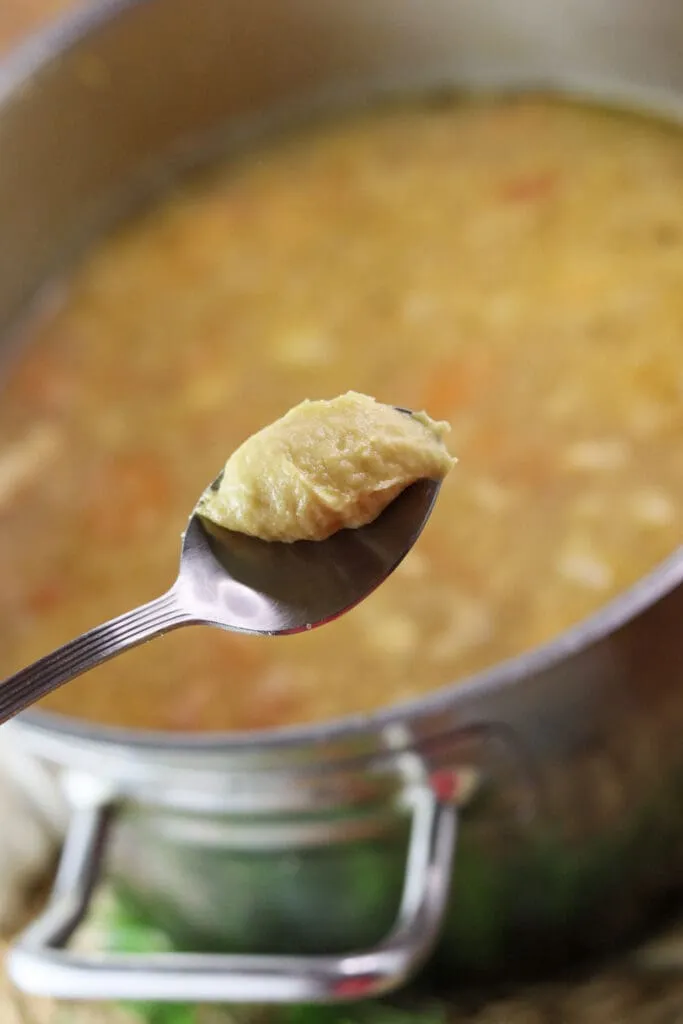 Adding dumplings to the soup.