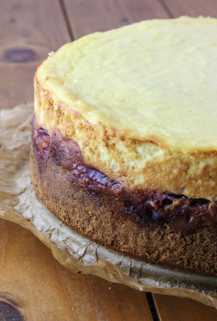 Freshly baked plum cheesecake in layers. 