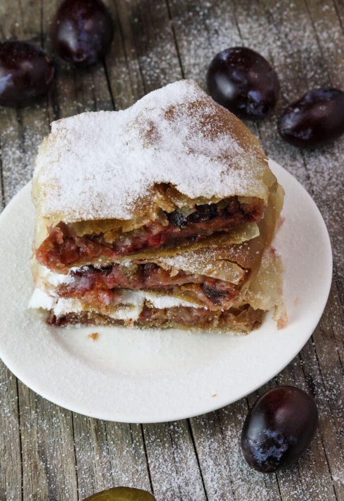 Plum strudel slices stacked on top of eachother.