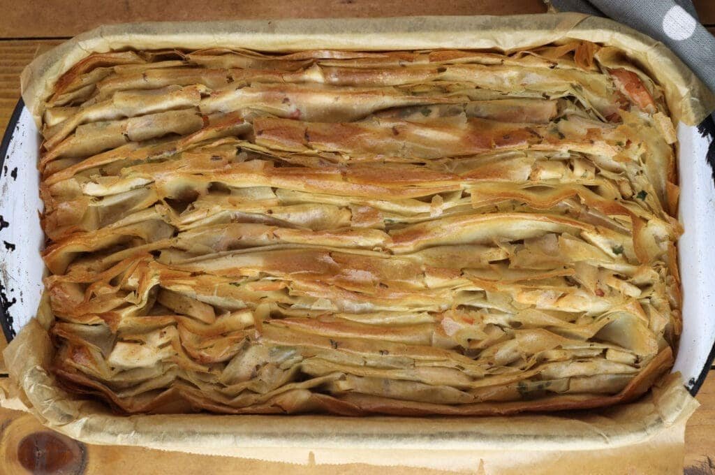 Image of the chicken of the woods pie after first fifteen minutes of baking, before pouring over the sour cream mixture