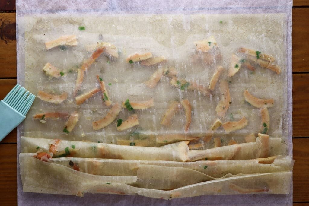 Image showing how to crinkle the phyllo sheets filled with sauteed chicken of the woods mushrooms