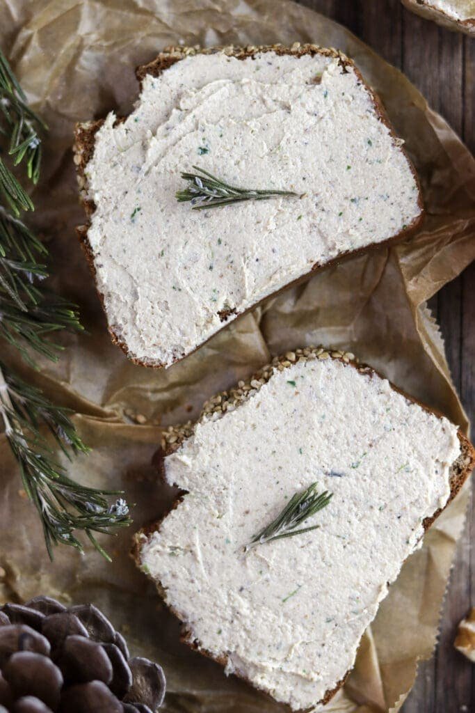 Two slices of bread with porcini mushroom walnut pate with rosemary