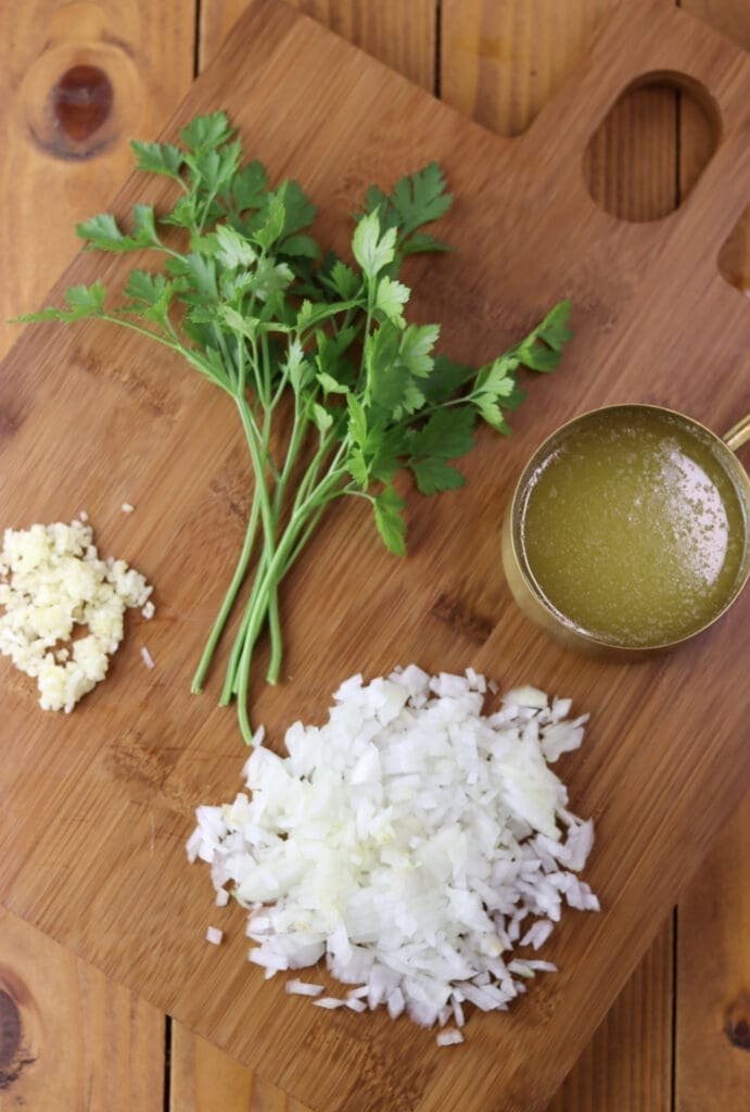 Image showing how to prepare butter, onion, garlic and parsley before making the pie.