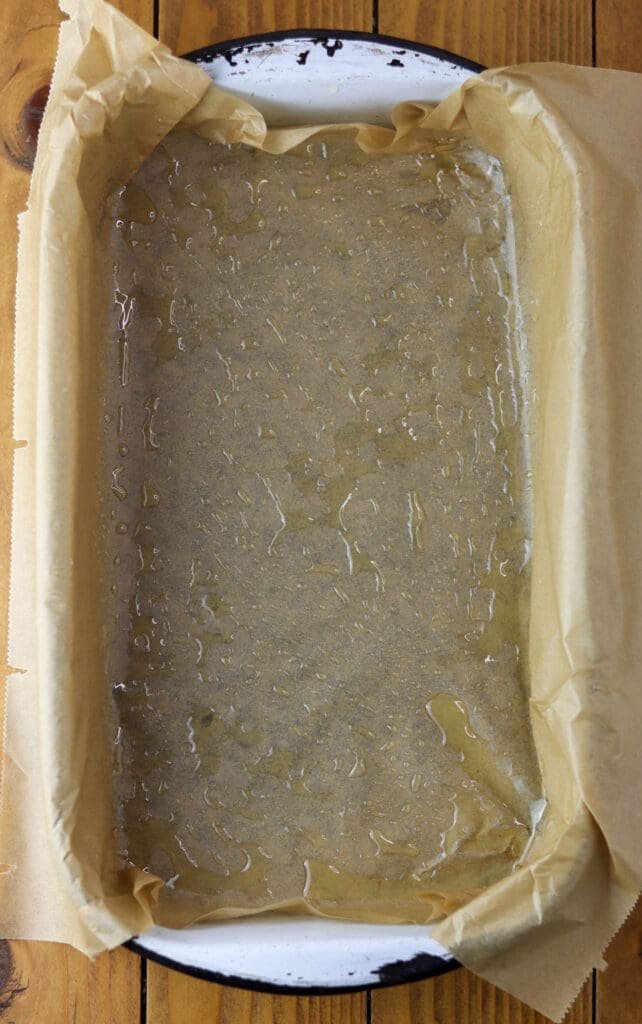Image showing a baking pan layered with greased parchment paper