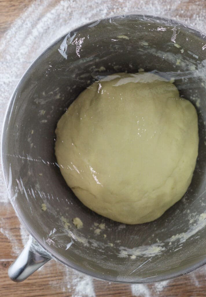 How to place the dough in the bowl and cover it with a plastic wrap to chill in the fridge before making the cookies