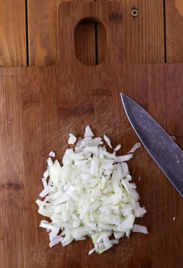How to thinly chop the onions before adding them to the filling mixture.