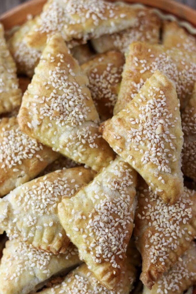 A stack of golden pocket cookies with pork craclings.