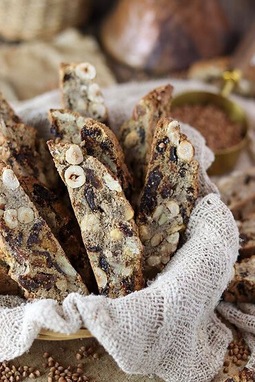 Crispy buckwheat biscotti arranged in a rustic basket