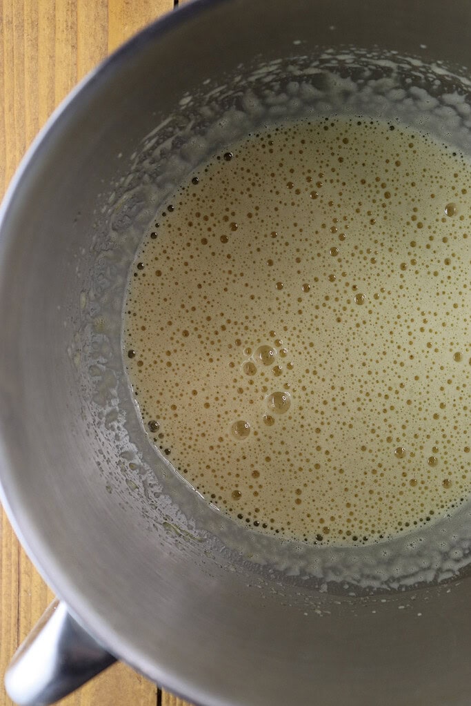 Whisked eggs with butter in a mixing bowl.