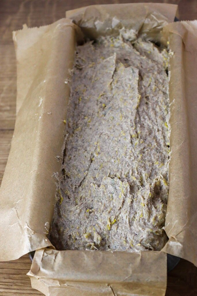 Dandelion buckwheat bread batter in a baking loaf pan before going to the oven.