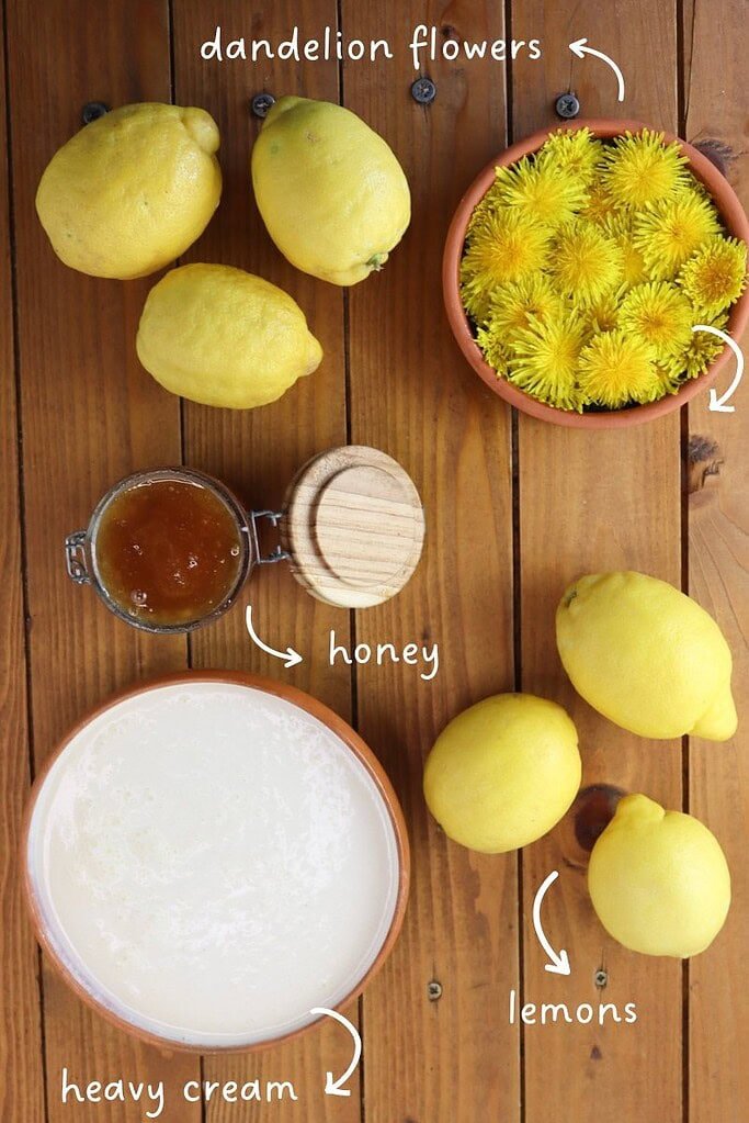 Ingredients needed for lemon dandelion dessert shells: six lemons, heavy cream, honey and fresh dandelion flowers.
